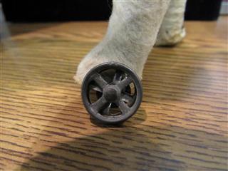 RARE ANTIQUE LATE 1800'S MOLDED CARDBOARD SPOTTED DOG W/GLASS EYES ON WHEELS